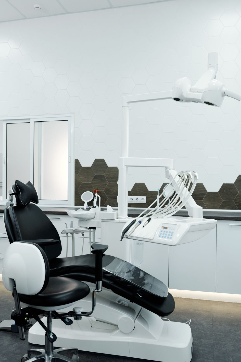 Dental chair and treatment area inside a clean, modern dental clinic